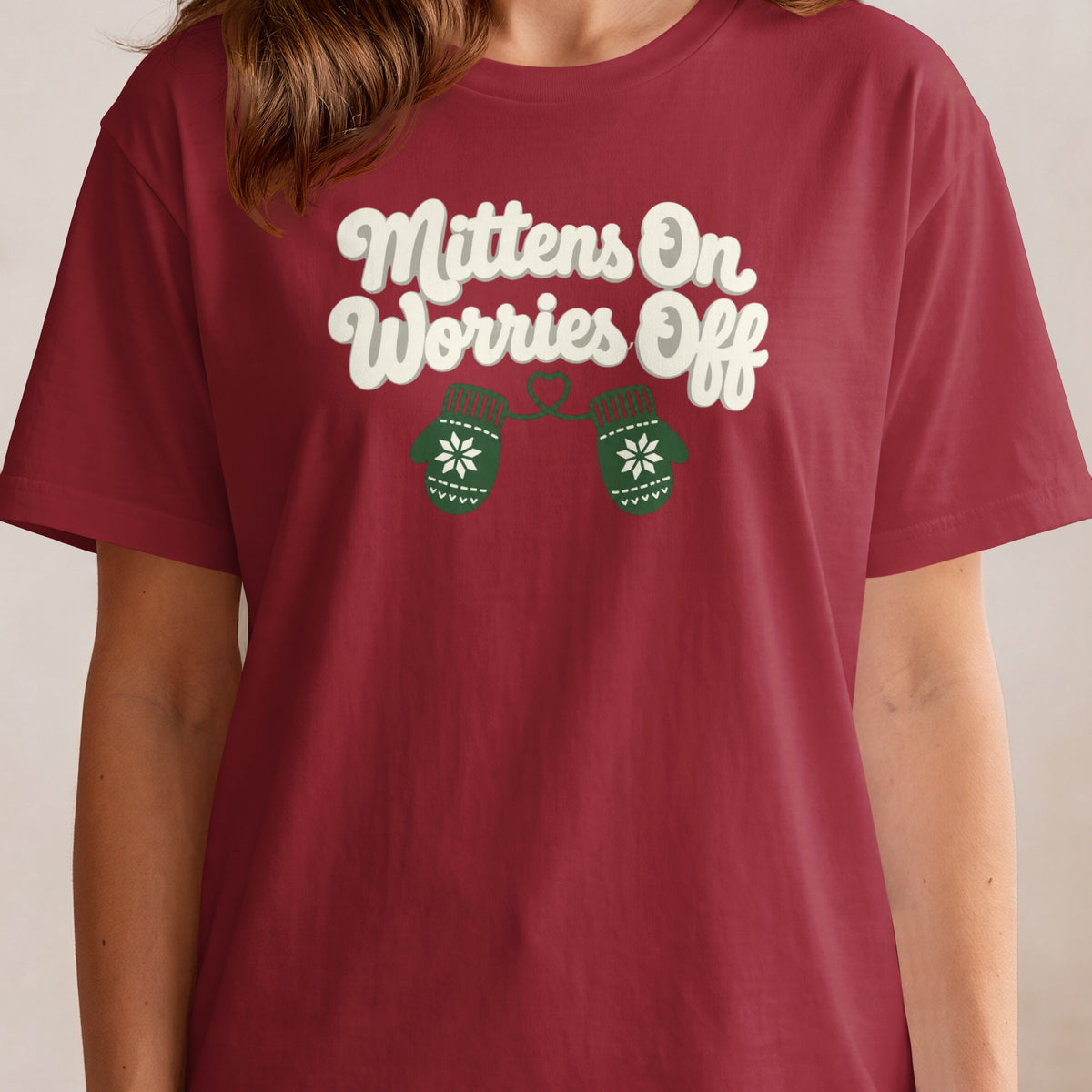 Burgundy t-shirt with "Mittens On Worries Off" and two green mittens.