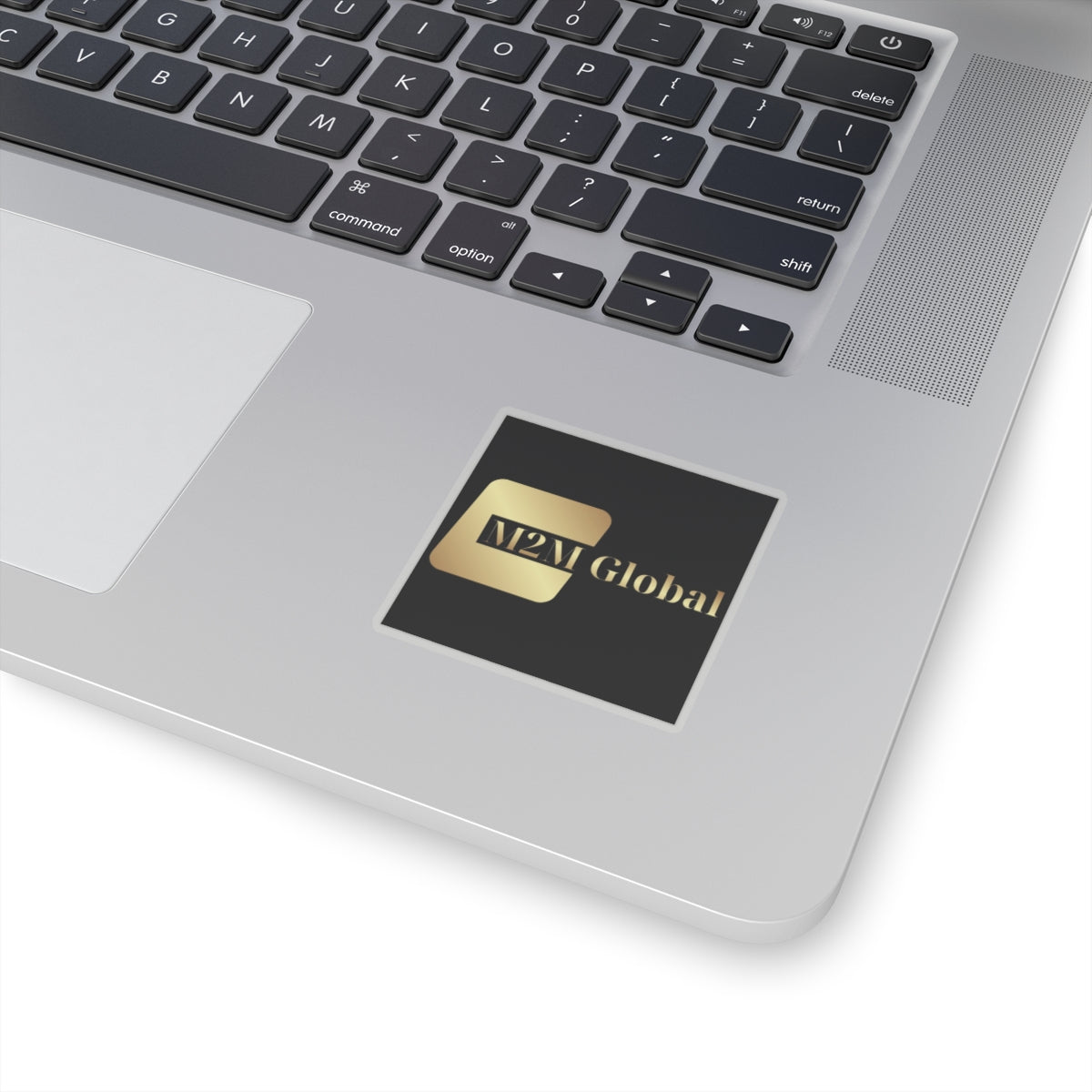 Gold 'M2M Global' logo on a gray background