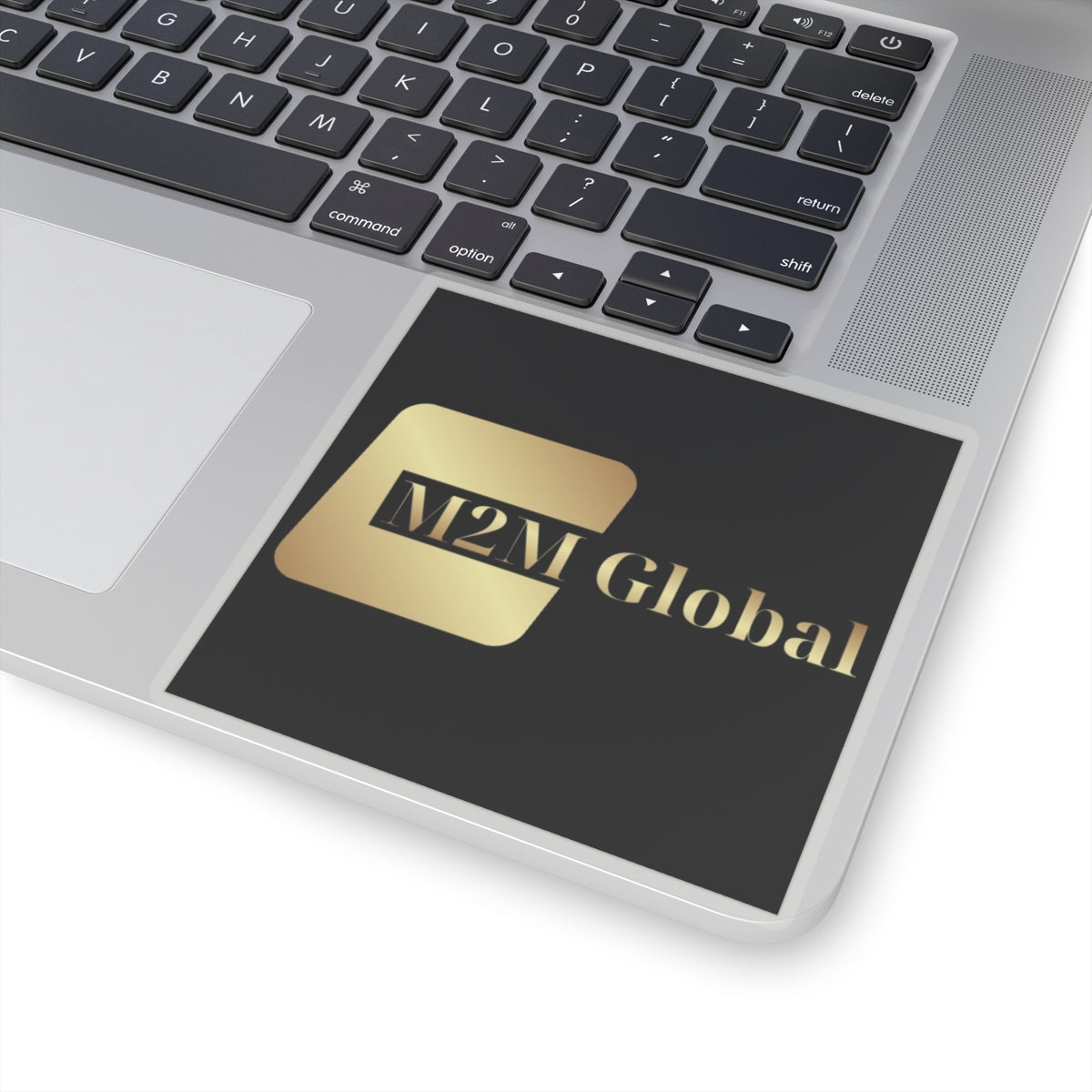 Gold 'M2M Global' logo on a gray background
