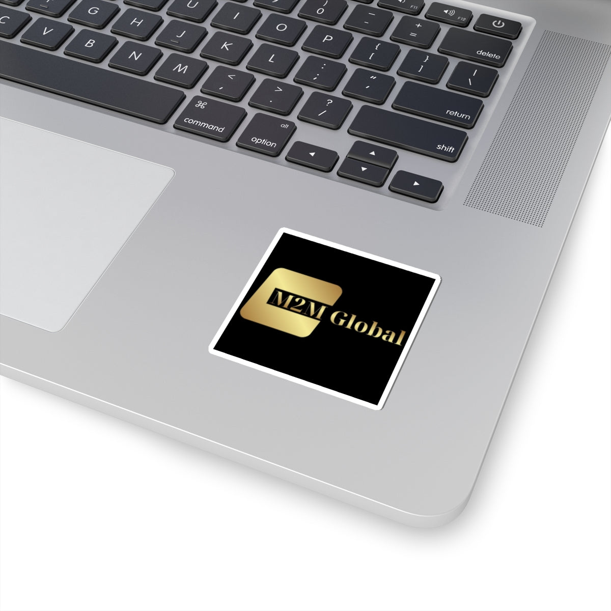 Gold 'M2M Global' logo on a gray background