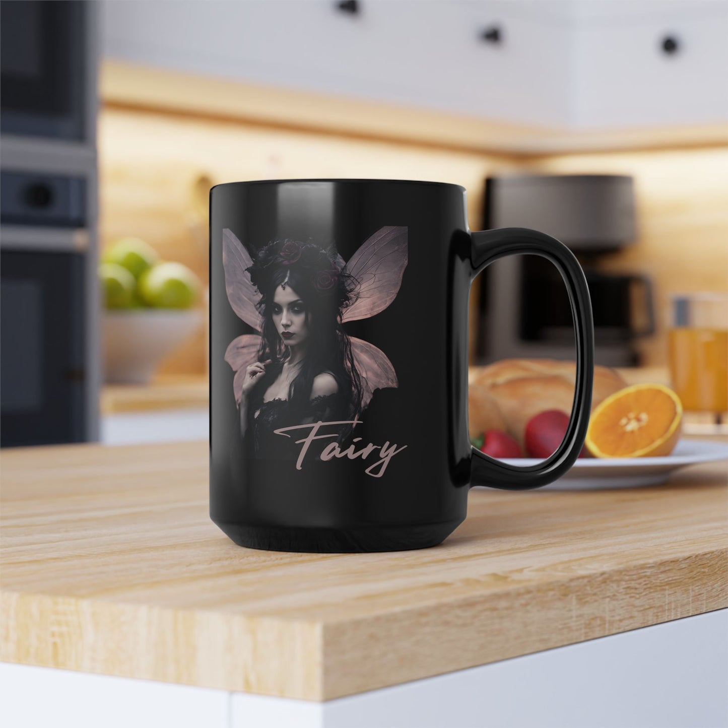Black mug with fairy design on a kitchen counter