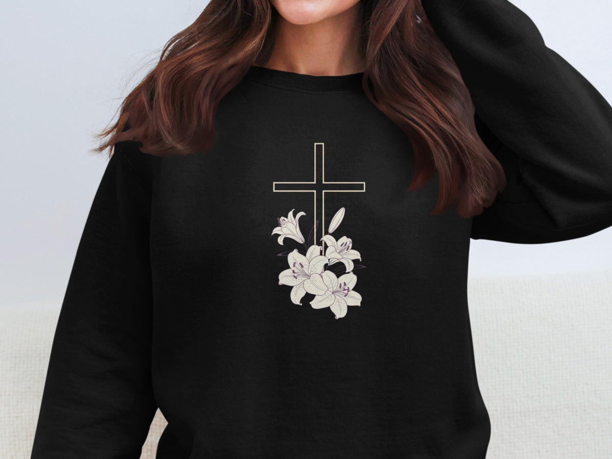 Black crewneck sweatshirt with a white cross and lilies graphic.