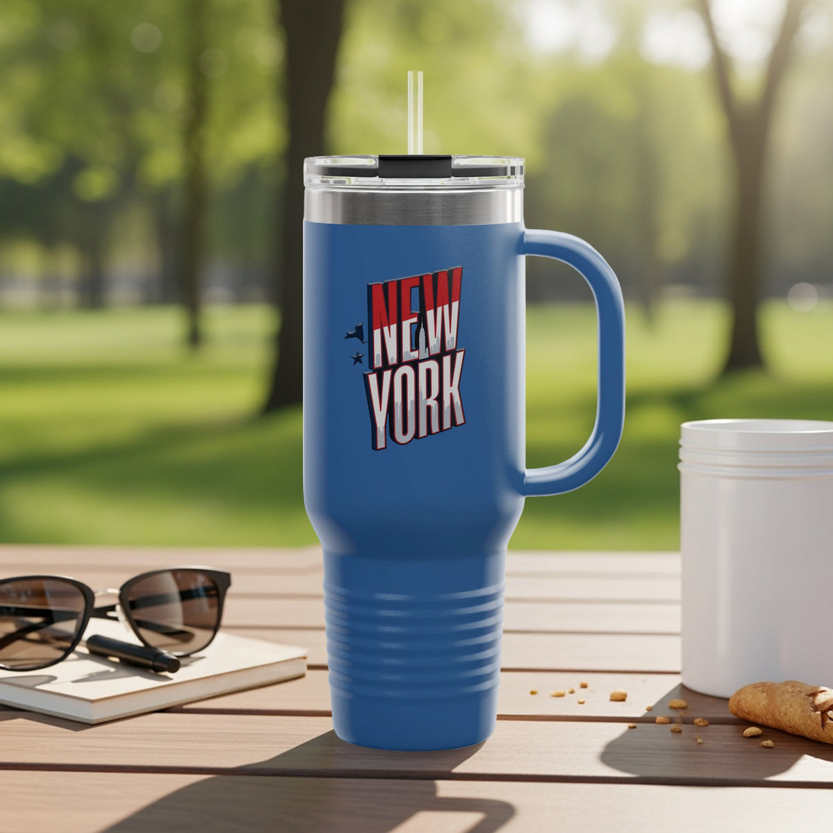 Tumbler with New York state outline graphic and city names.