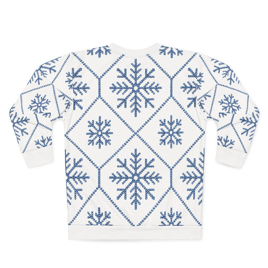 White sweatshirt with blue knitted snowflake and diamond pattern.