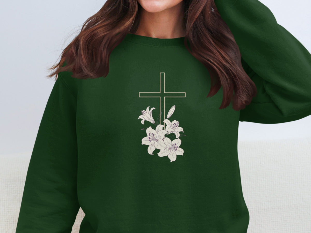 Green sweatshirt with embroidered cross and lilies design.