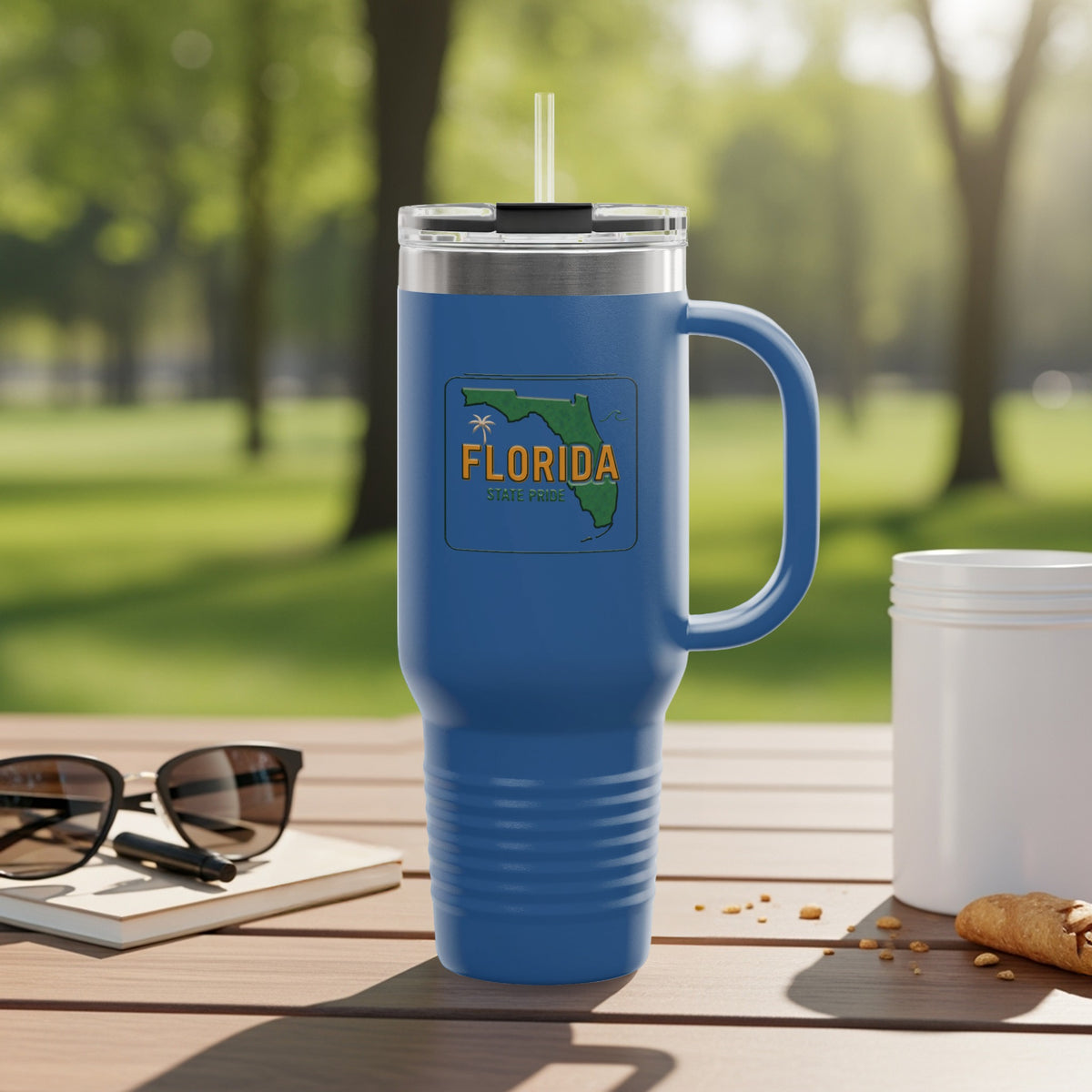 Blue travel mug with Florida outline and "State Pride" text.