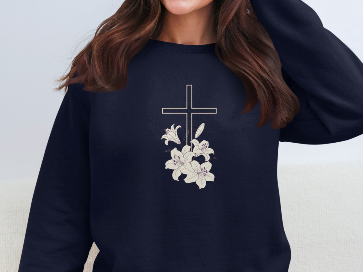 Navy sweatshirt with a white cross and lilies design.