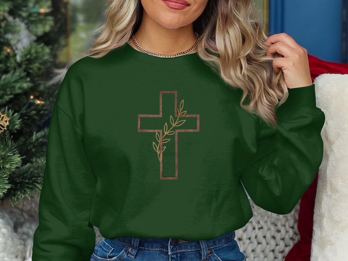 Dark green sweatshirt with a brown outlined cross and vine design.