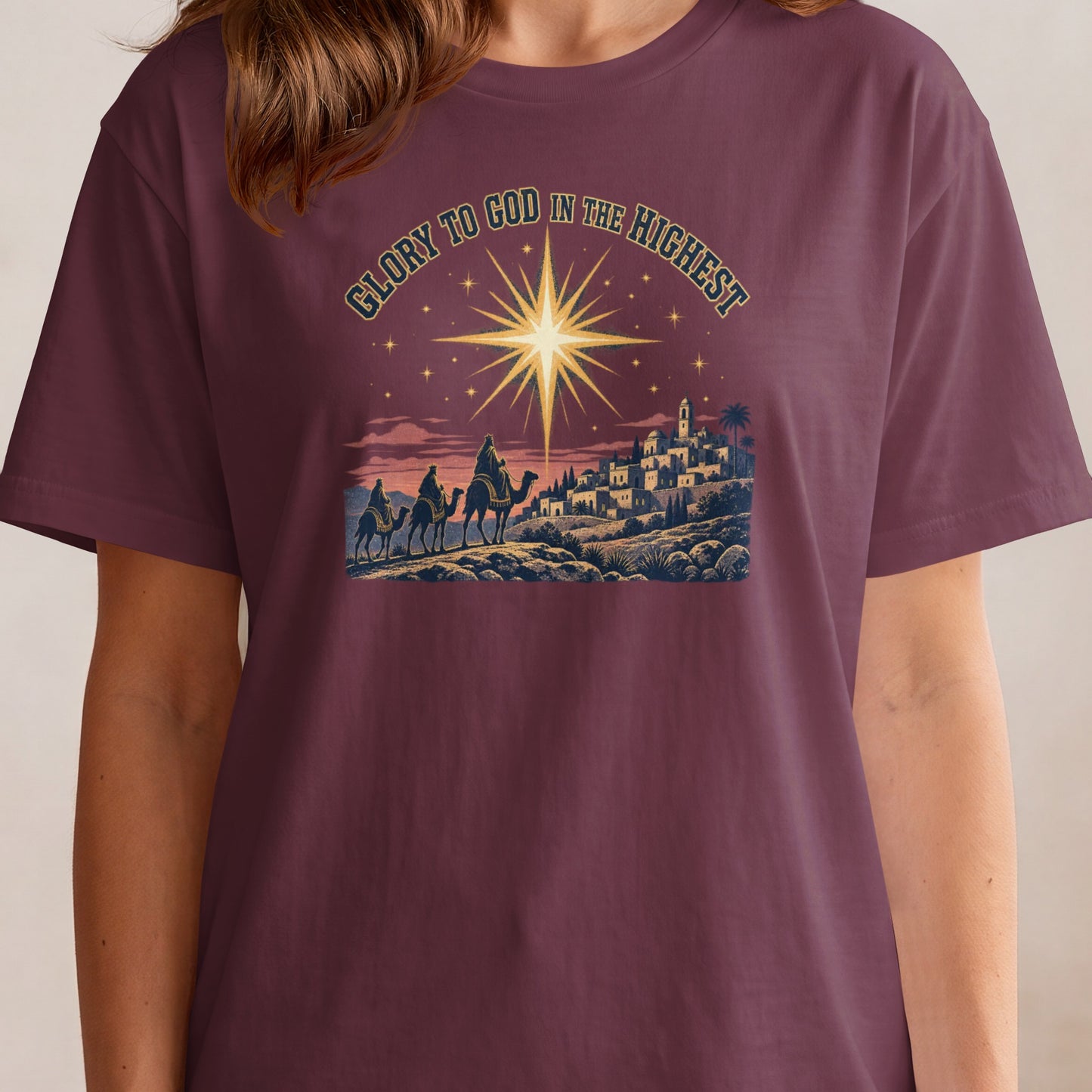 "Glory to God in the Highest" text above a nativity scene with three wise men on camels.