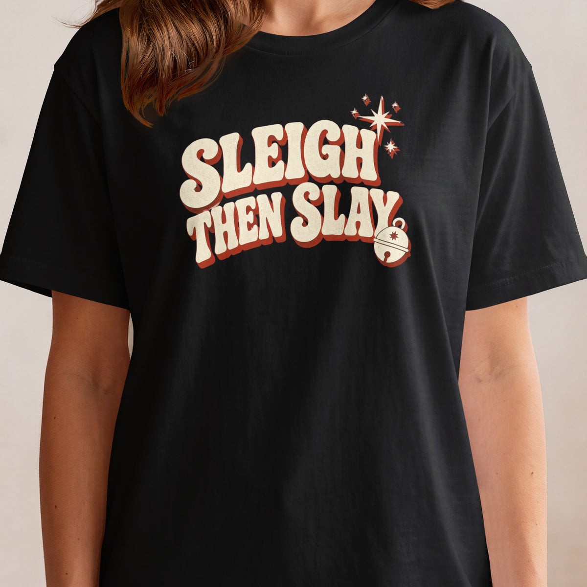 Black t-shirt with "Sleigh Then Slay" text and Christmas bell graphic.