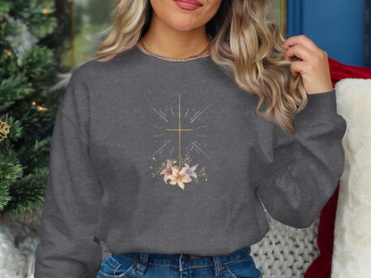Dark gray crewneck sweatshirt with floral and sunburst graphic.
