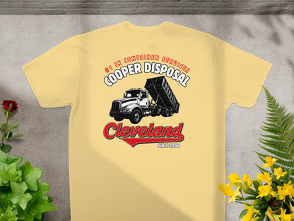 Yellow t-shirt with Cooper Disposal logo featuring a dump truck and "Cleveland Since 2006".