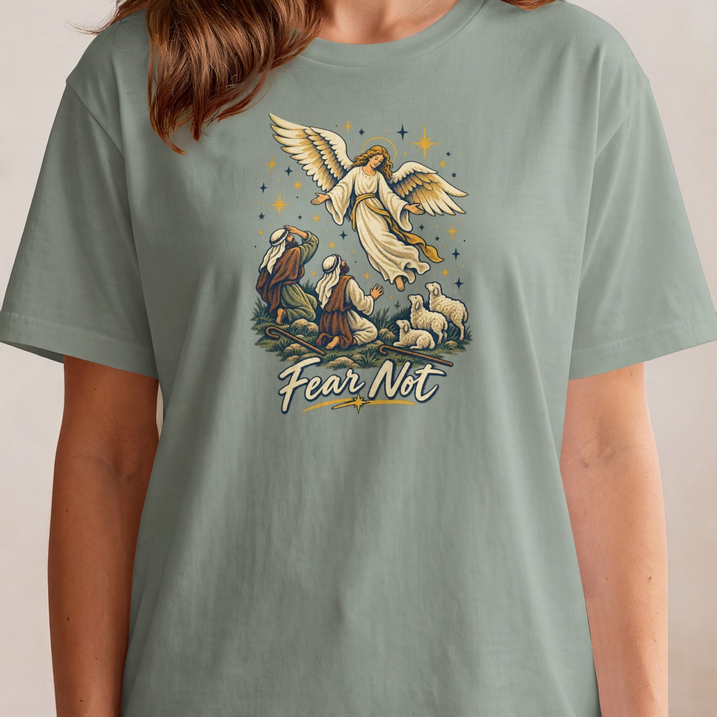 Angel appearing to shepherds with sheep, text "Fear Not" below.