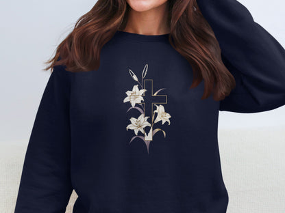 Dark sweatshirt with a gold cross and white lilies graphic.
