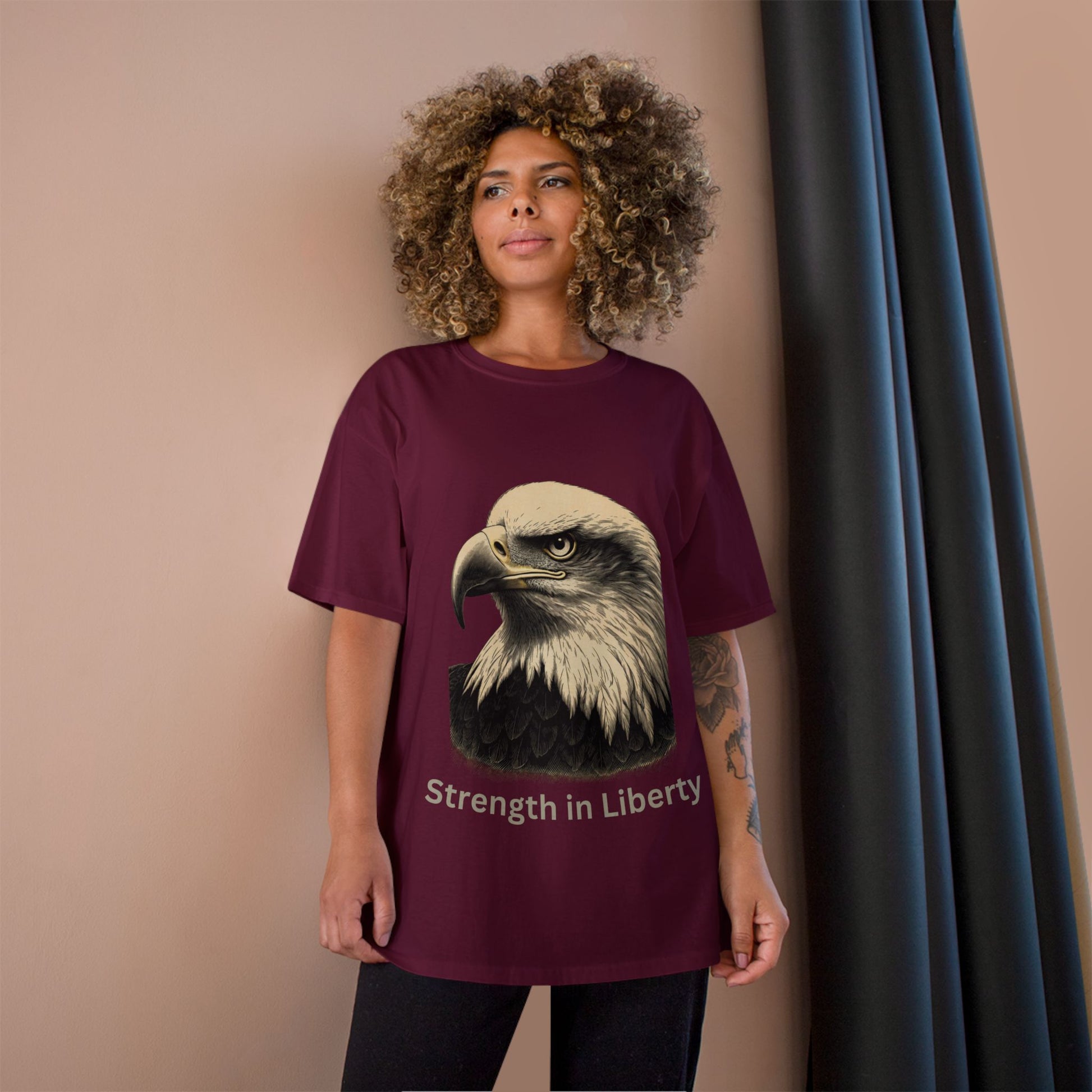 Engraved Eagle - Strength in Liberty - text on the bottom of a Champion Tee
