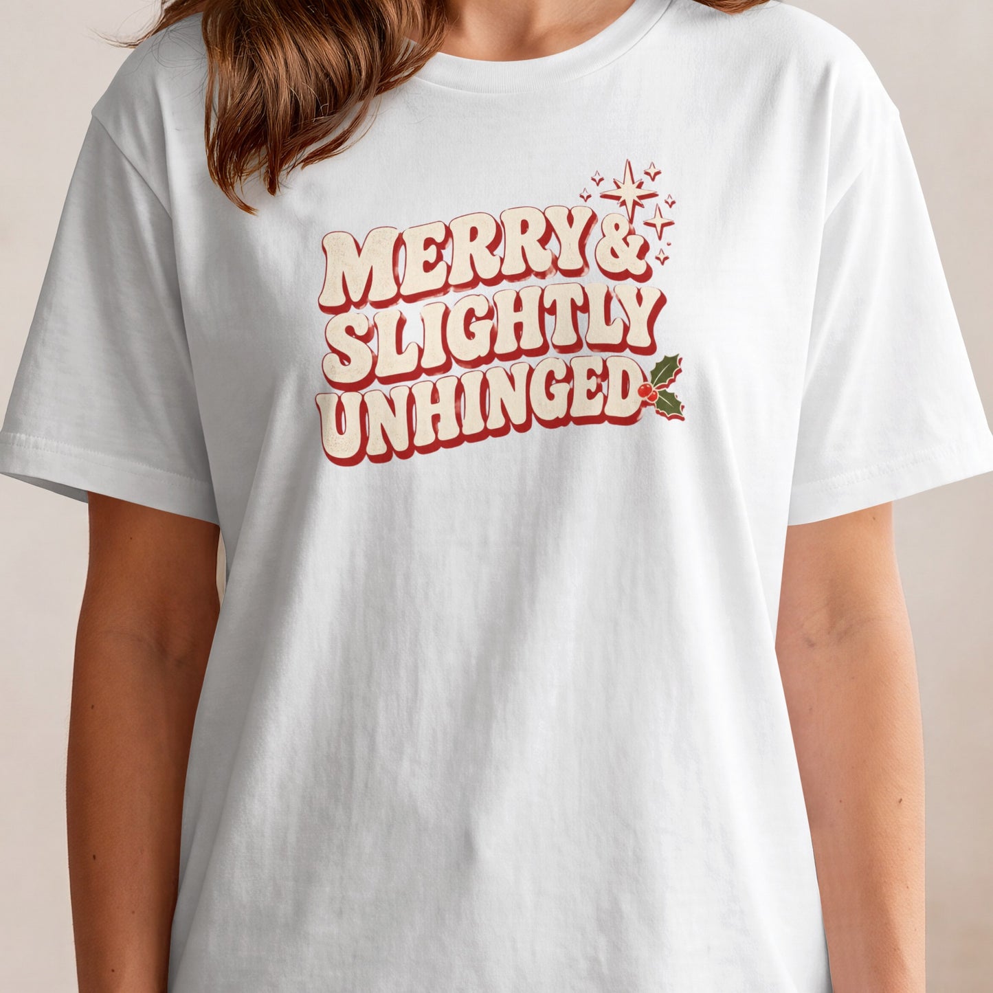 White t-shirt with "Merry & Slightly Unhinged" text and Christmas holly.