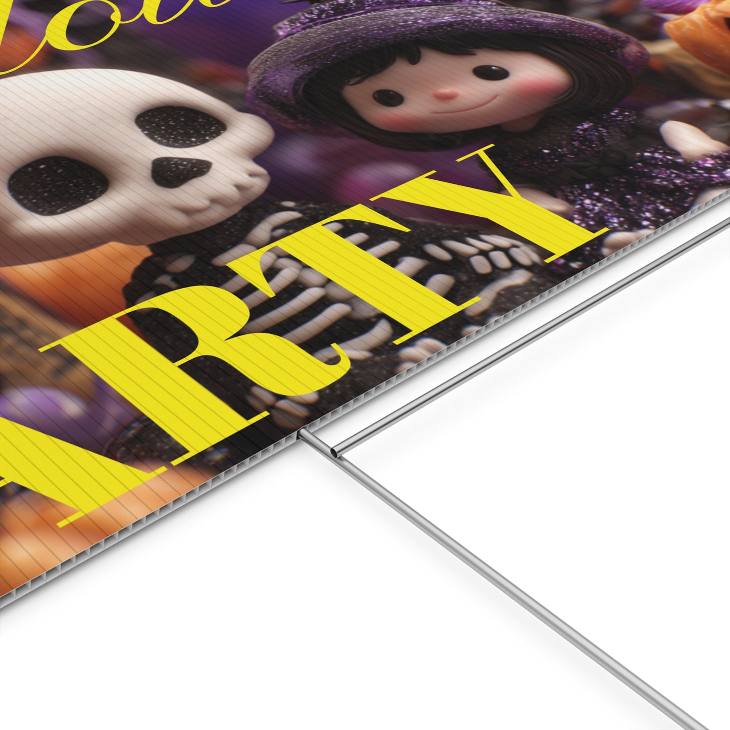 Halloween-themed party sign with cartoon characters on a grassy lawn