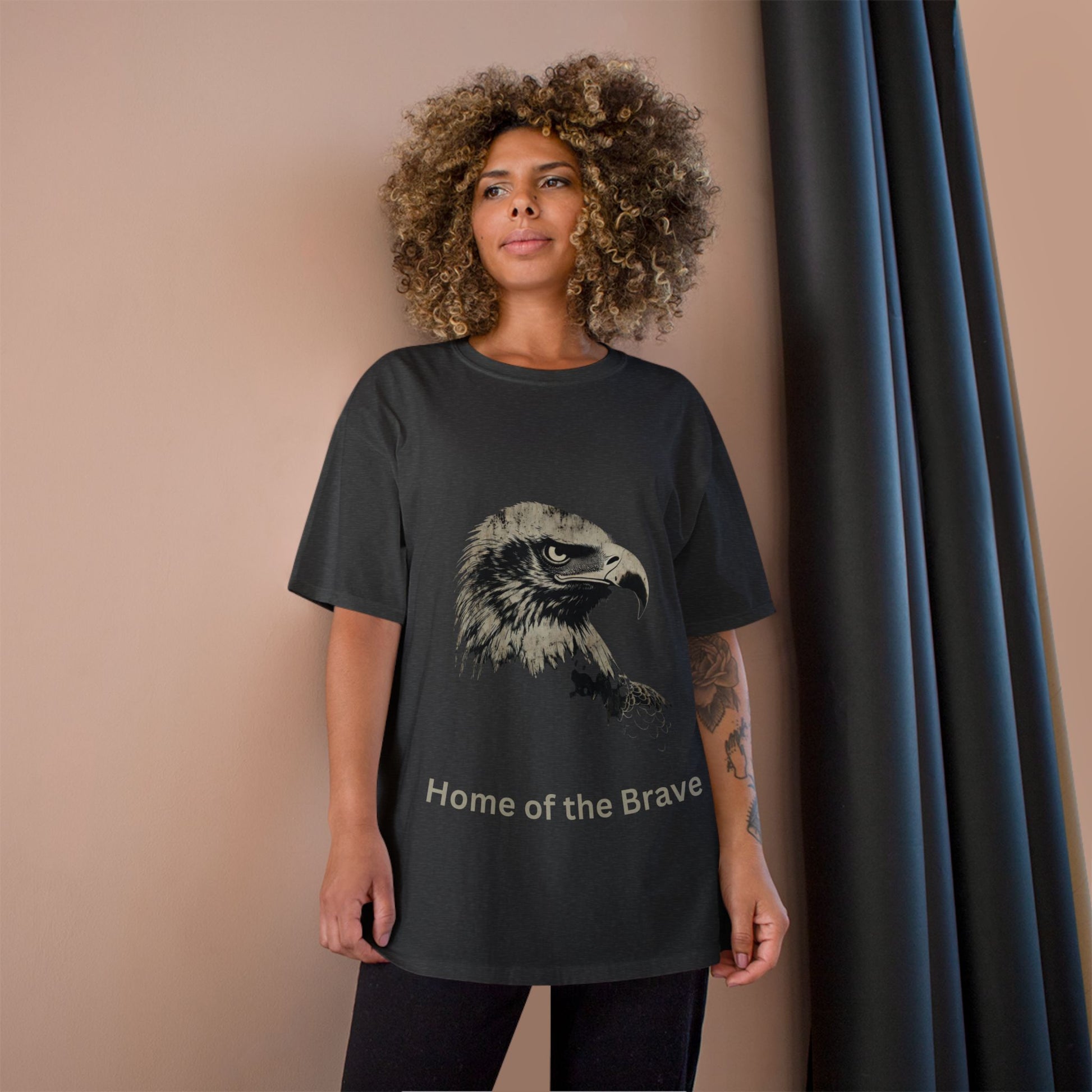 Home of the Brave text below an eagle head on a Champion Tee