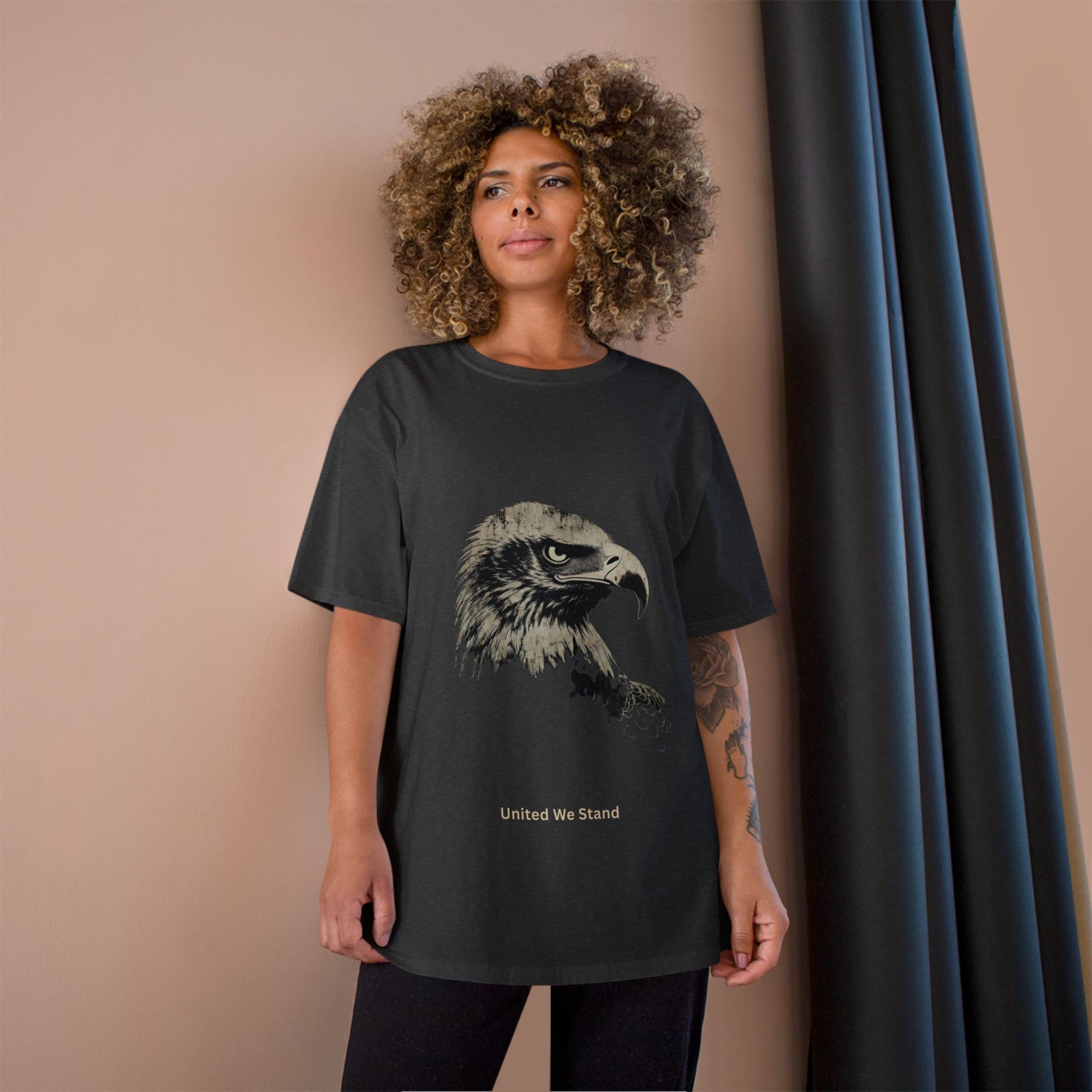 United We Stand small font text below an eagle head on a Champion Tee