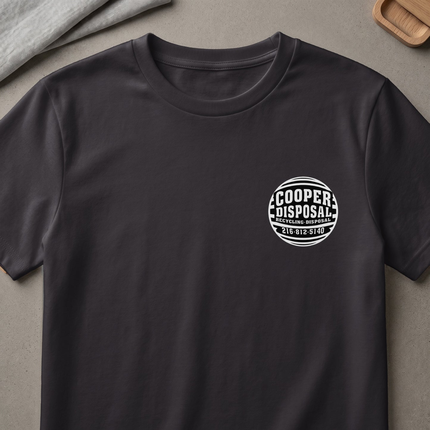 Dark grey t-shirt with white Cooper Disposal Recycling Disposal logo on chest.