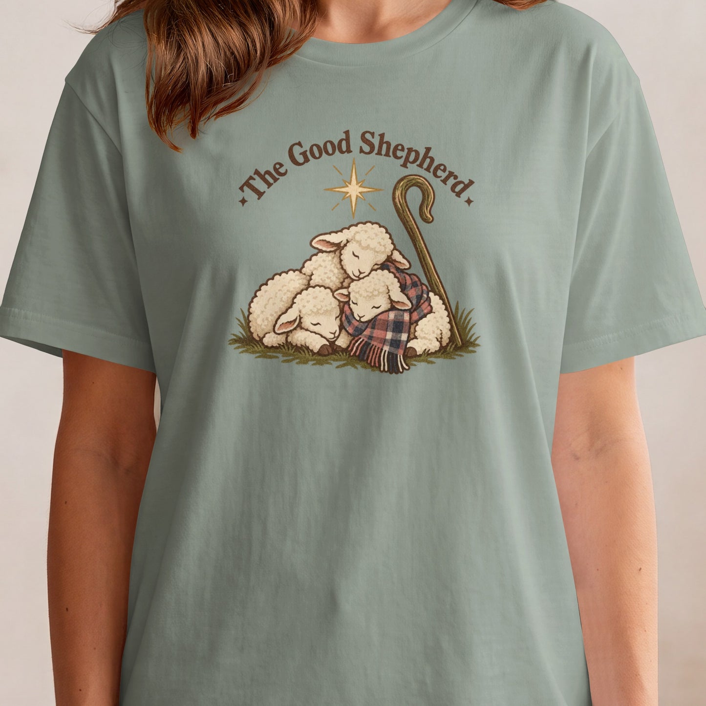 "The Good Shepherd" text with three sleeping sheep and a shepherd's crook.