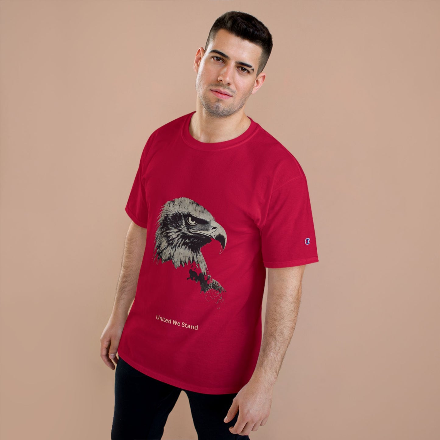 United We Stand small font text below an eagle head on a Champion Tee