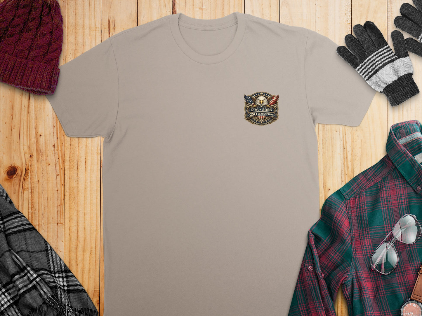 Tan t-shirt with American flag logo celebrating 250 years of freedom.