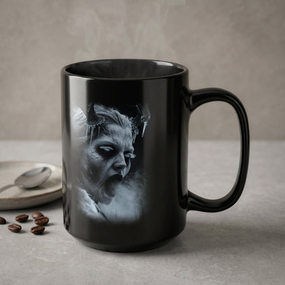 Black mug with steam rising, featuring a monochrome image of a demonic face.