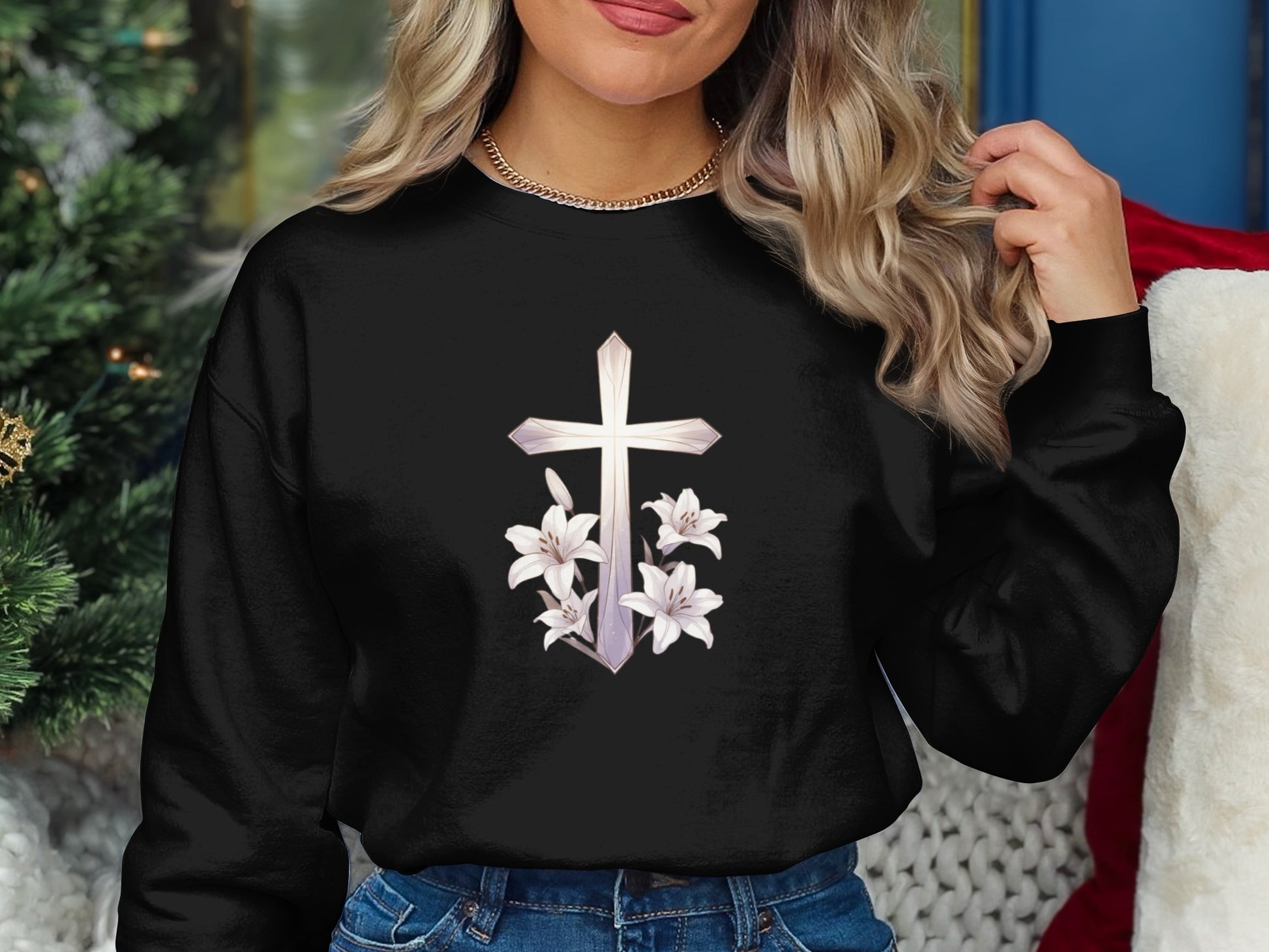 Black sweatshirt with white lily and cross graphic.