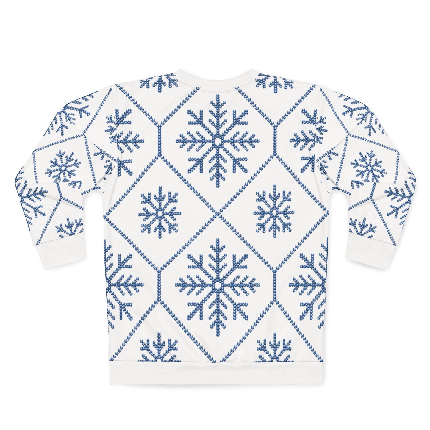 White sweatshirt with blue knitted snowflake and diamond pattern.