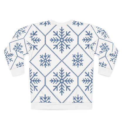White sweatshirt with blue knitted snowflake and diamond pattern.