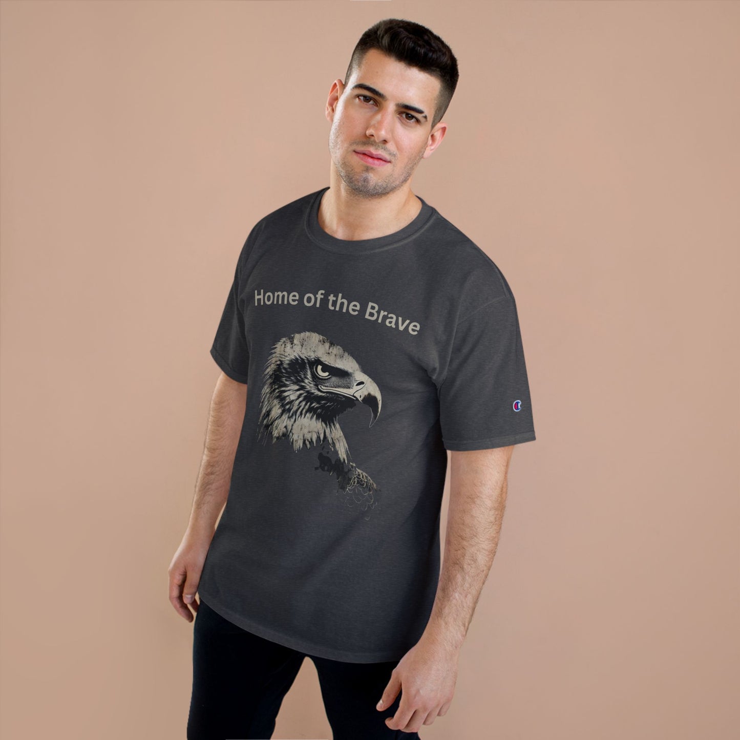 Home of the Brave text above an eagle head on a Champion Tee