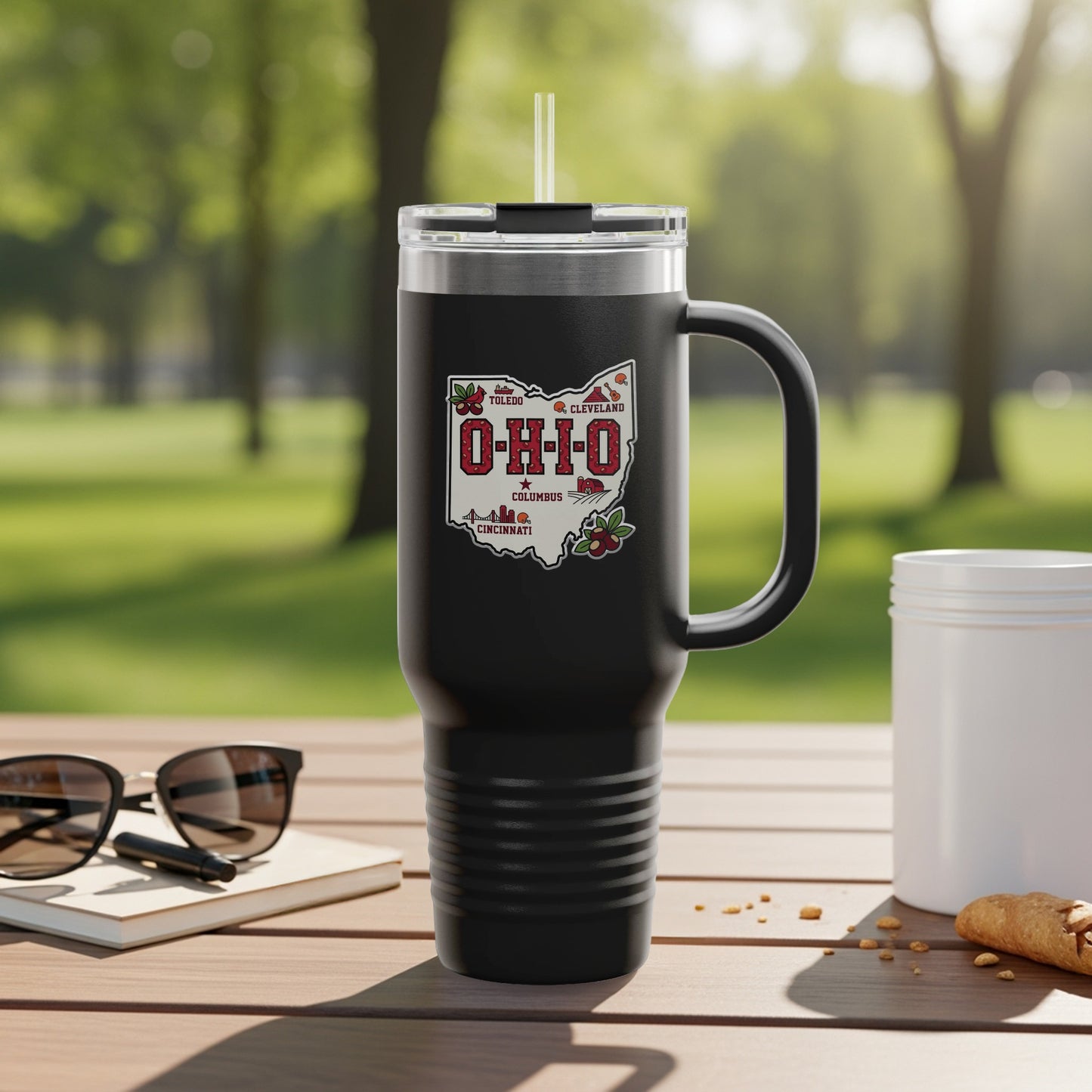 Travel mug with Ohio map graphic and city names.