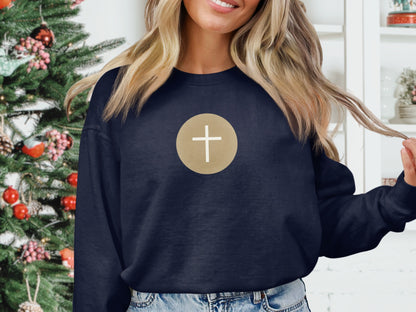 Navy sweatshirt with white cross inside a gold circle logo.