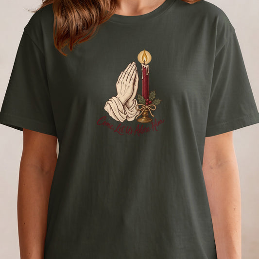 Dark t-shirt with a Christmas graphic of praying hands and a candle.