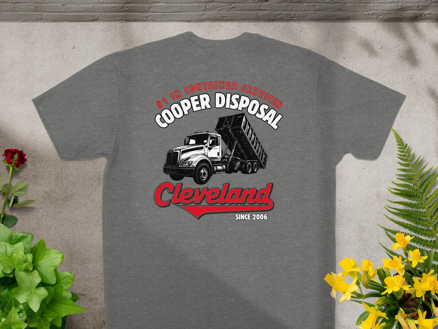 Cooper Disposal Cleveland t-shirt with dump truck graphic and red arrow.