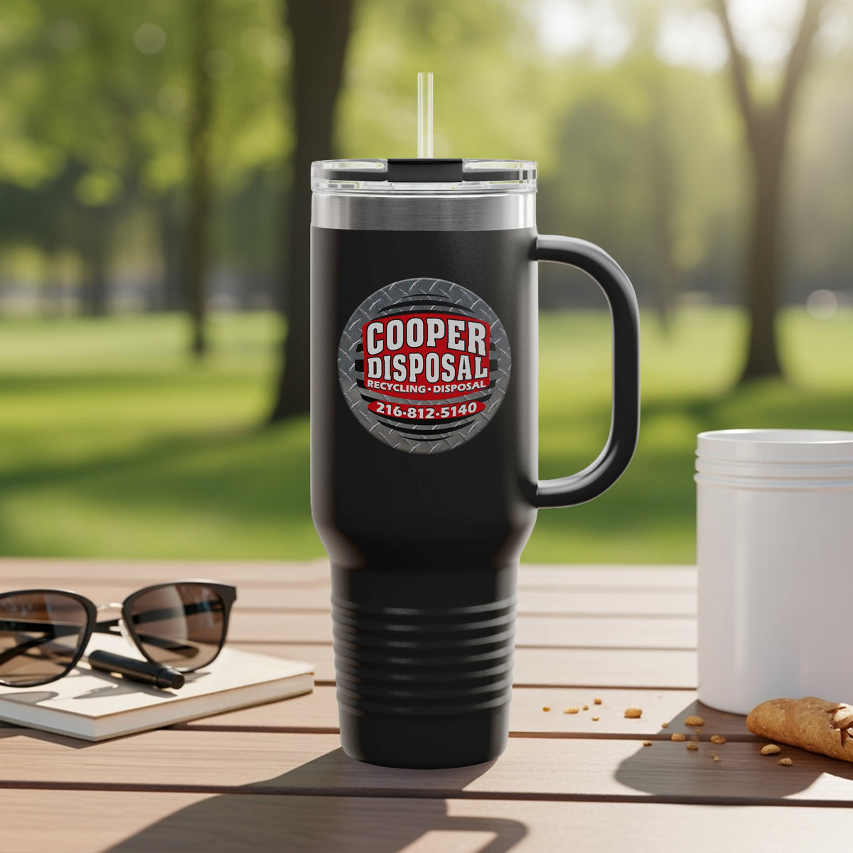 Black travel mug with Cooper Disposal logo and phone number 216-812-5140.