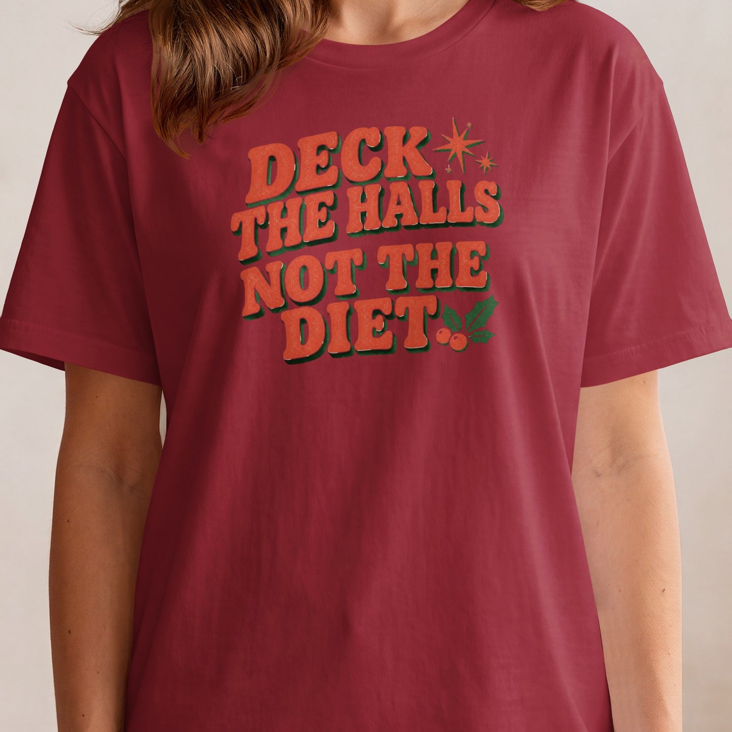 Burgundy t-shirt with retro text "DECK THE HALLS NOT THE DIET".