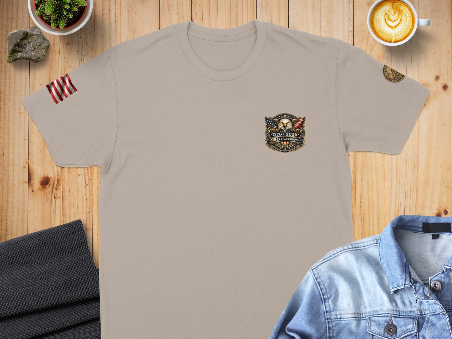 Tan t-shirt with 1776-2026 patriotic eagle emblem and text.