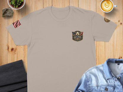 Tan t-shirt with 1776-2026 patriotic eagle emblem and text.
