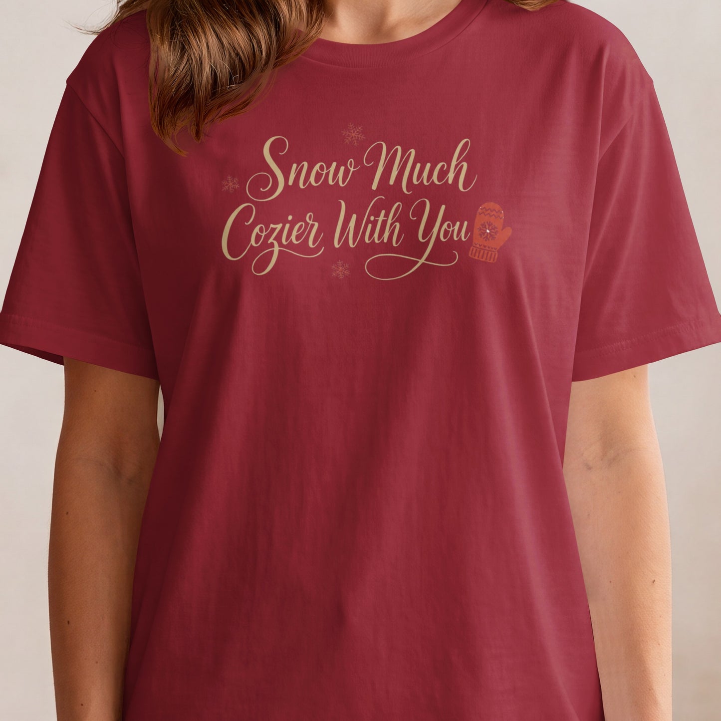 Maroon t-shirt with "Snow Much Cozier With You" text and a mitten graphic.