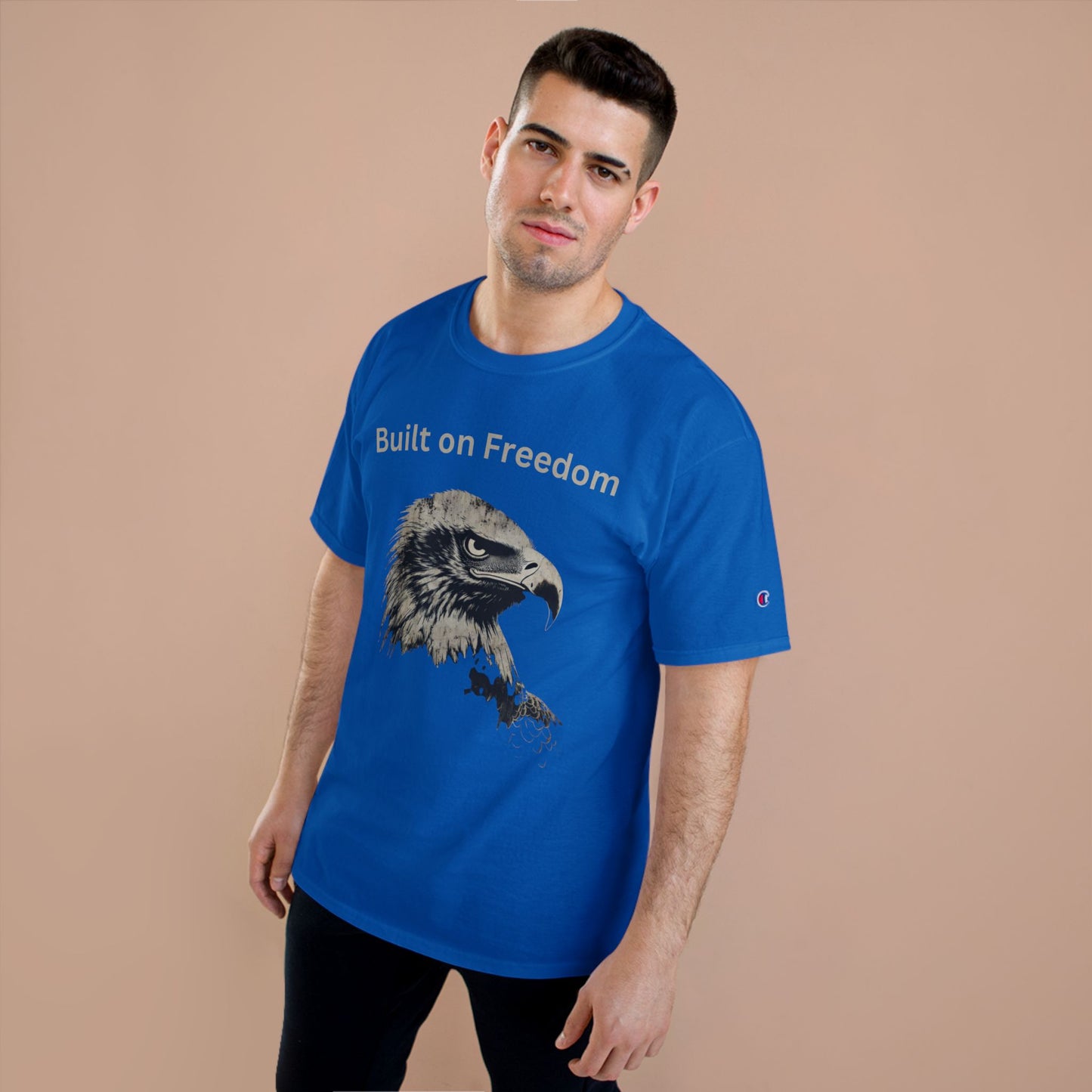 Built on Freedom text above an eagle head on a Champion Tee