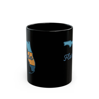 Black mug with Florida map outline and cursive text.