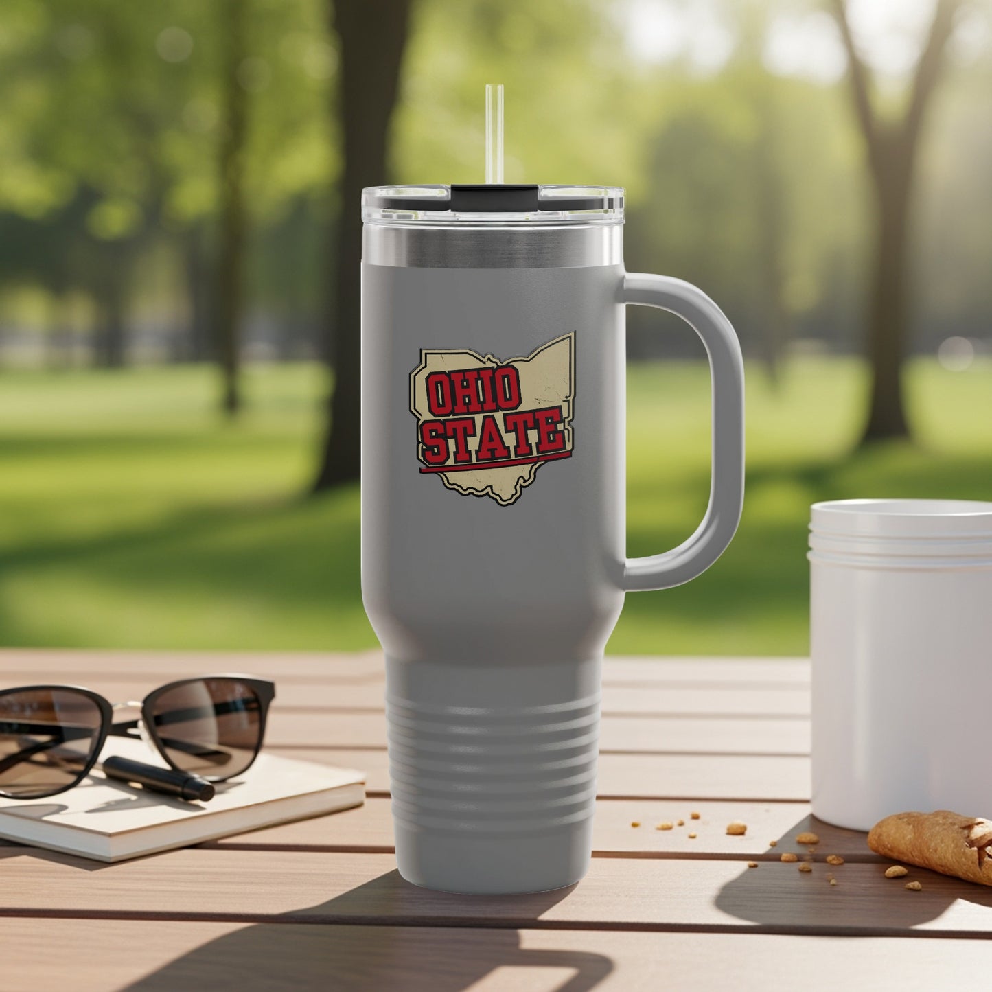 Travel mug with Ohio map graphic and city names.
