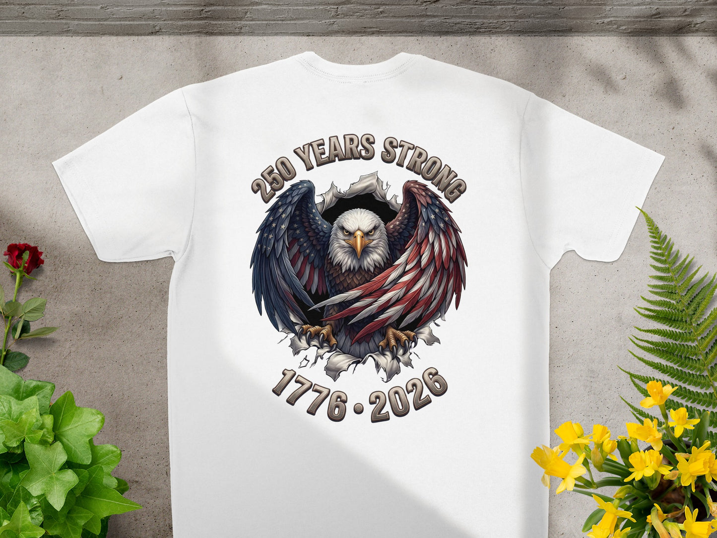 White t-shirt featuring an eagle with "250 Years Strong" and "1776-2026".