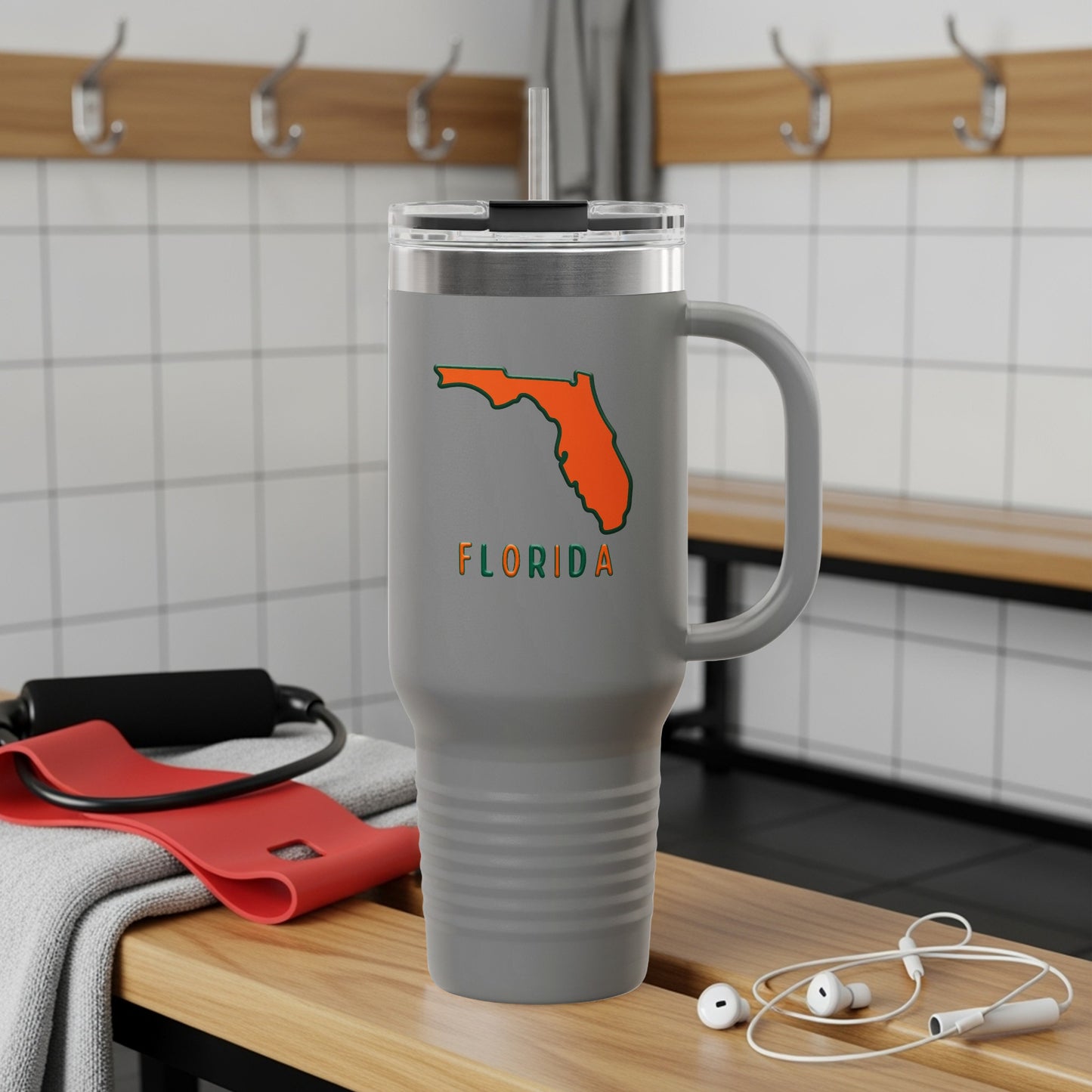 Gray tumbler with orange Florida outline and "FLORIDA" text.