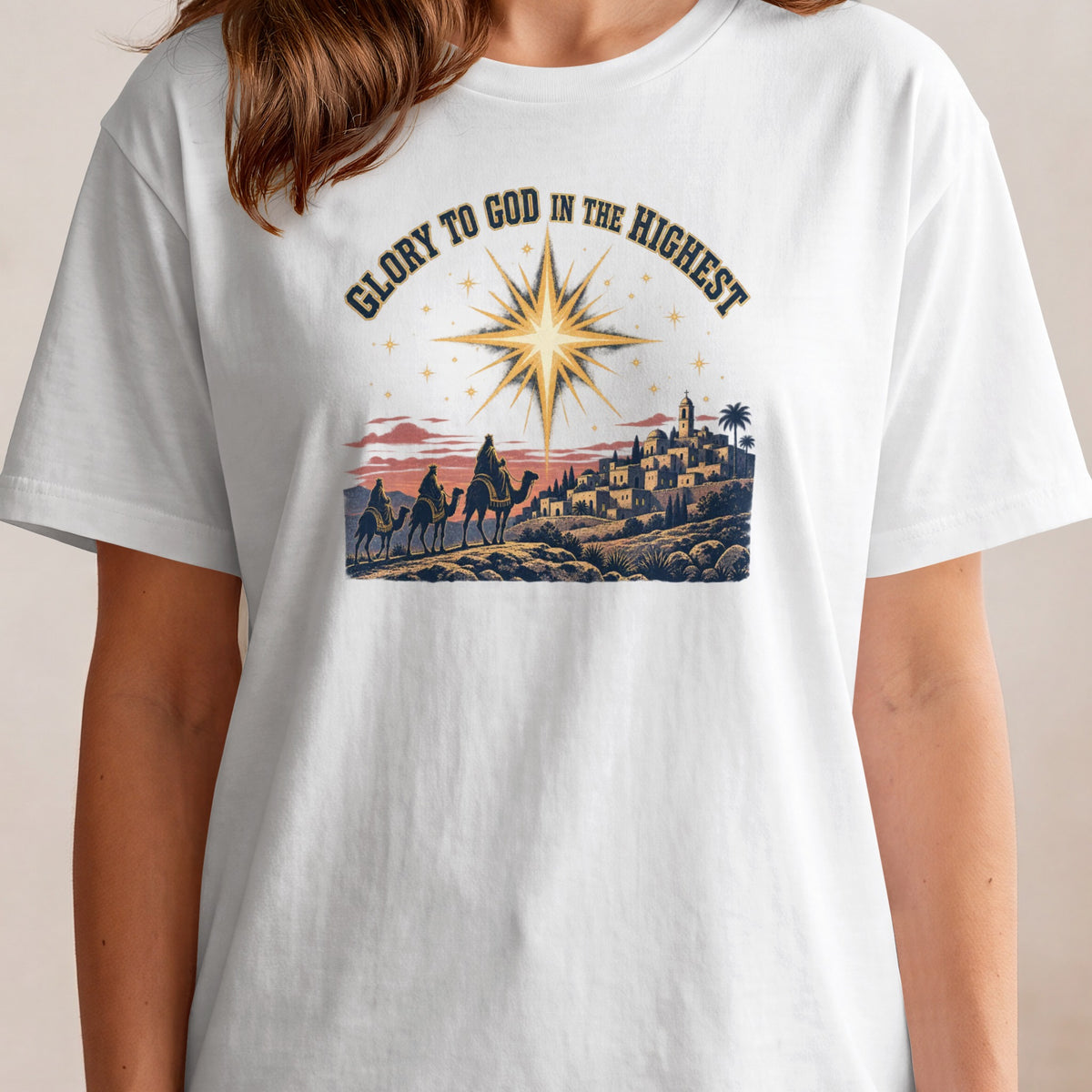 Three camels approach a city under a bright star with text "Glory to God in the Highest".