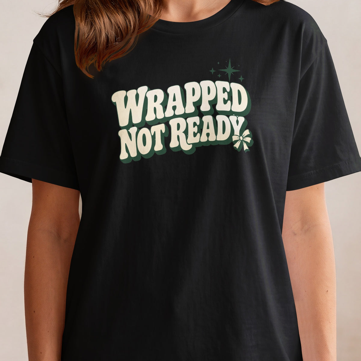 Black t-shirt with "WRAPPED NOT READY" text and holiday graphics.