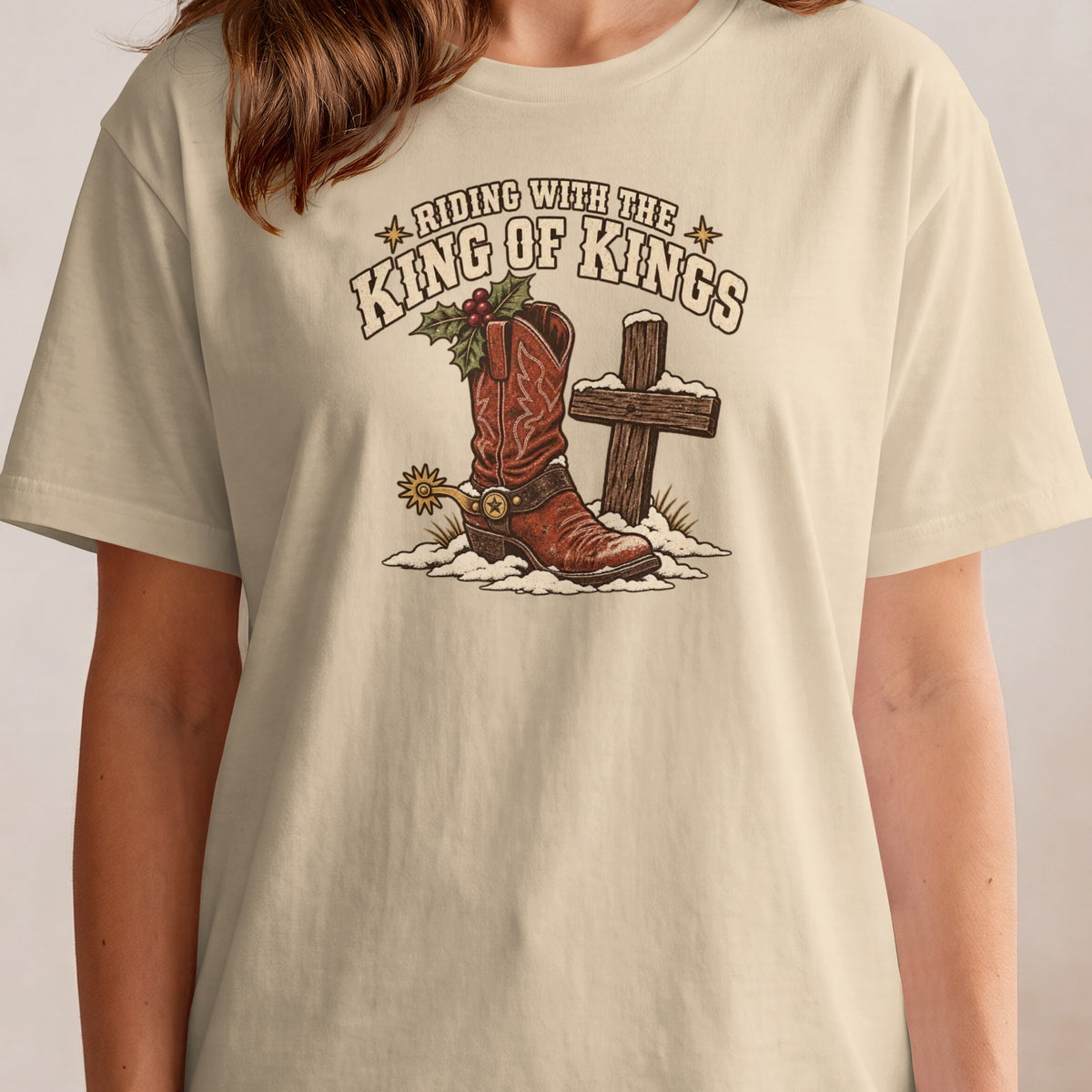 Riding with the King of Kings graphic on a light beige t-shirt.