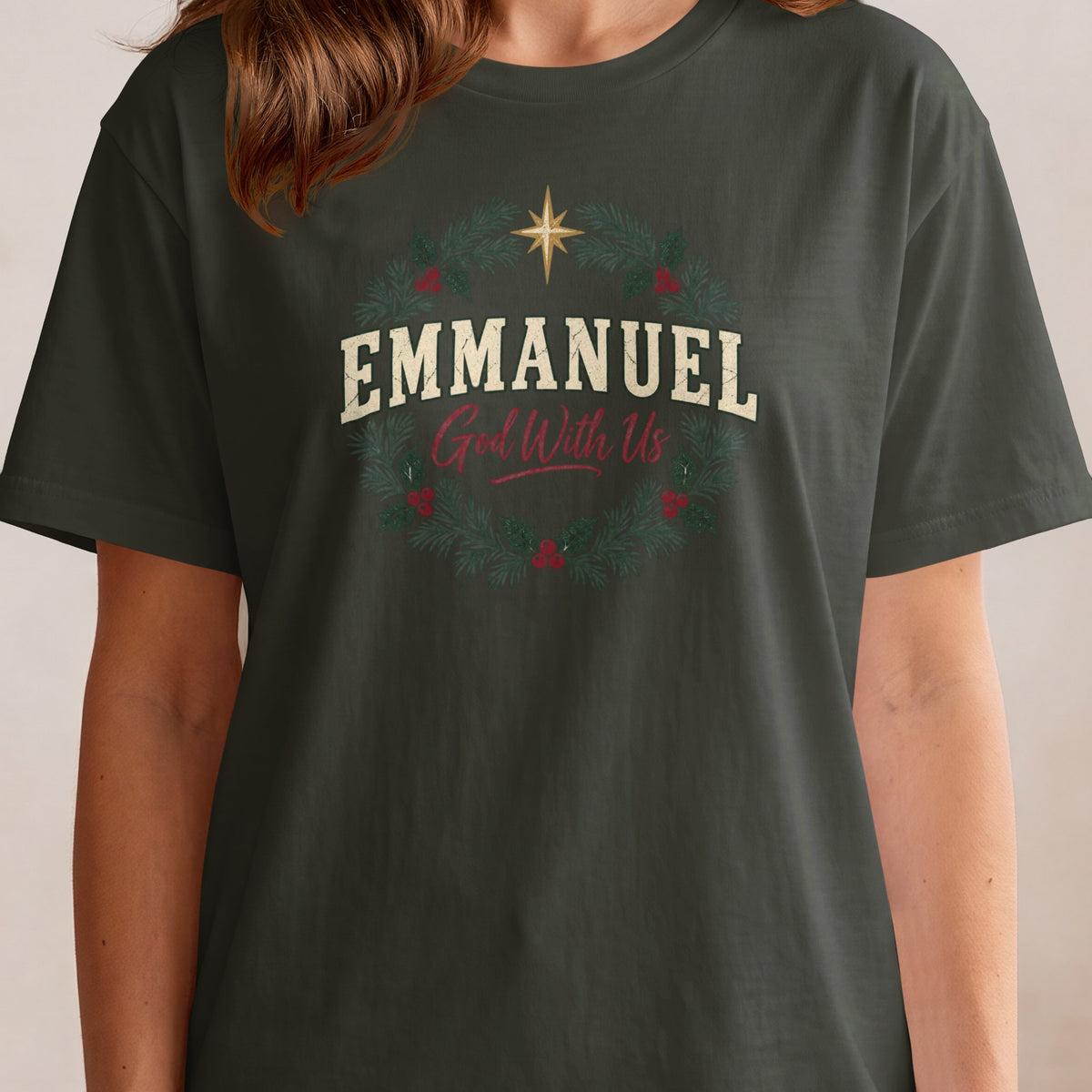 Dark green t-shirt with "EMMANUEL God With Us" text and Christmas wreath.